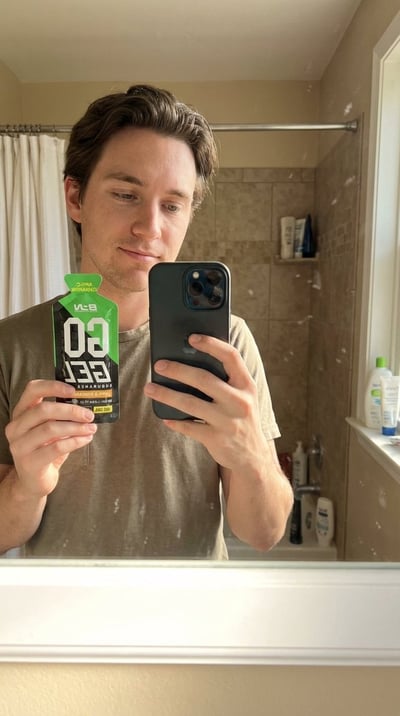 Hyper-Realistic Bathroom Mirror Selfie Holding a Product thumbnail