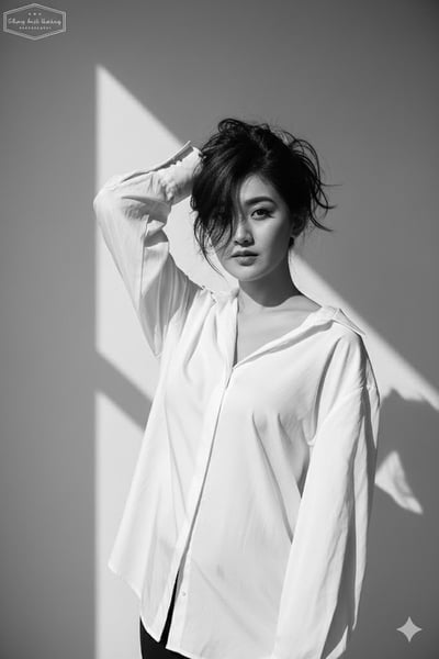 Black-and-White High-Fashion Editorial Portrait in a Loose White Blouse thumbnail