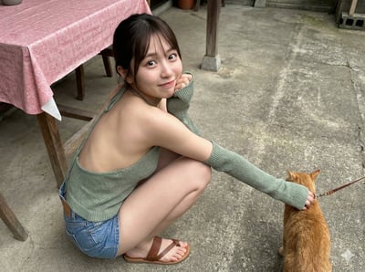 High-Angle Ultra-Realistic Candid Photo of a Young Asian Woman in a Courtyard With a Cat (8K) thumbnail