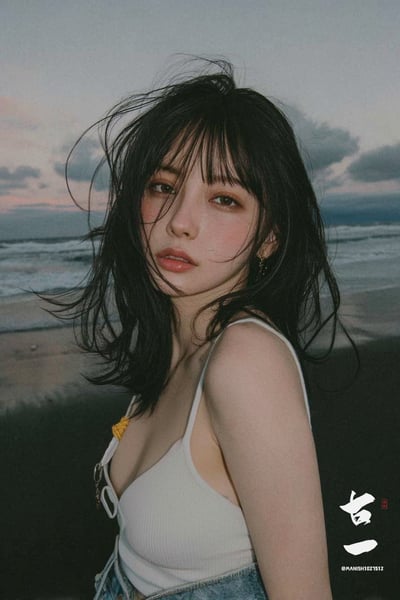 Moody Dusk Beach Film-Style Portrait of a Young Woman thumbnail